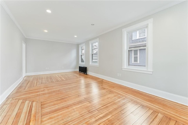 unfurnished living room featuring crown molding and light wood-type flooring