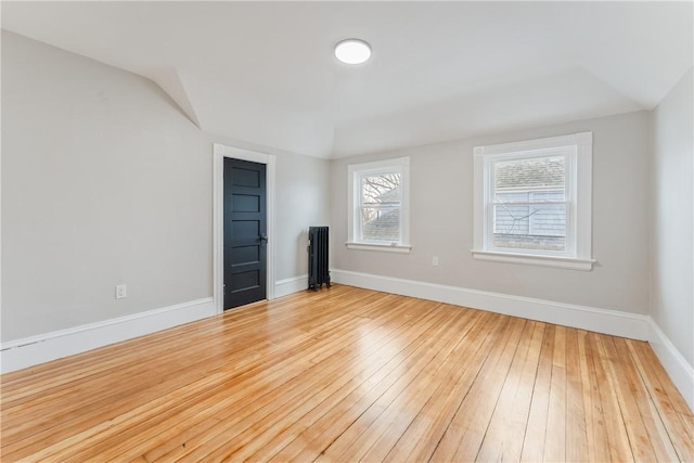 spare room featuring light hardwood / wood-style flooring