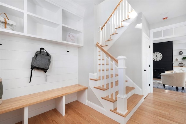 mudroom with light hardwood / wood-style floors