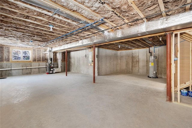 basement featuring water heater and heating unit