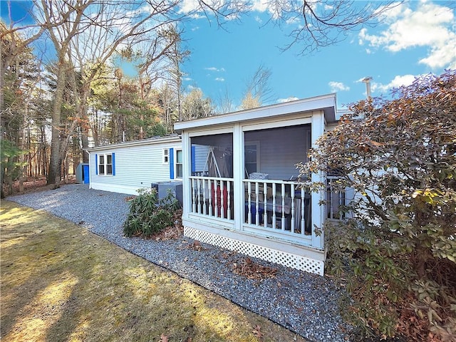 view of front of home with a sunroom