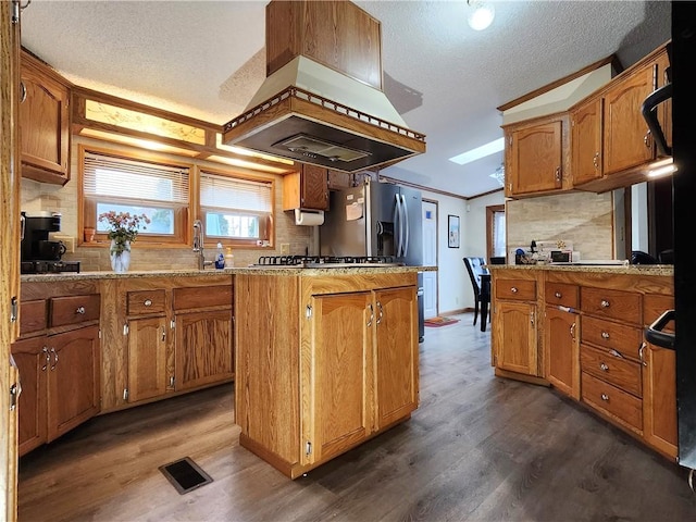 kitchen with premium range hood, dark hardwood / wood-style floors, backsplash, and crown molding