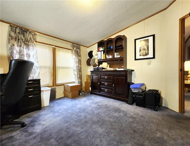 carpeted home office with crown molding, vaulted ceiling, and a textured ceiling