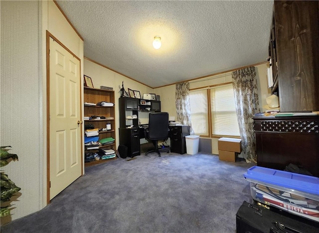 carpeted office with lofted ceiling, ornamental molding, and a textured ceiling