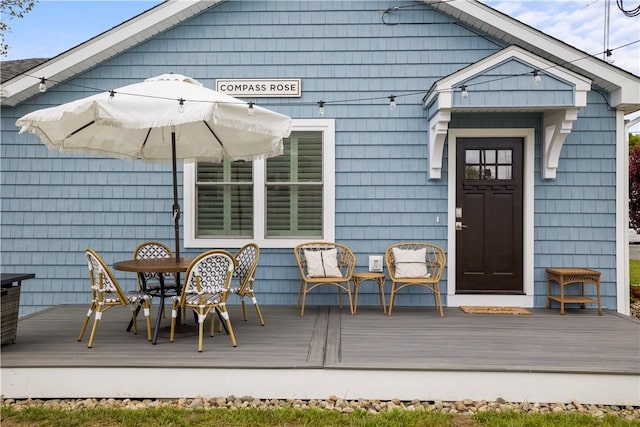 rear view of house featuring a deck