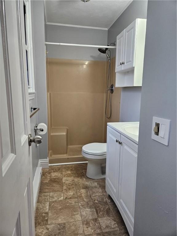 bathroom with vanity, toilet, and walk in shower