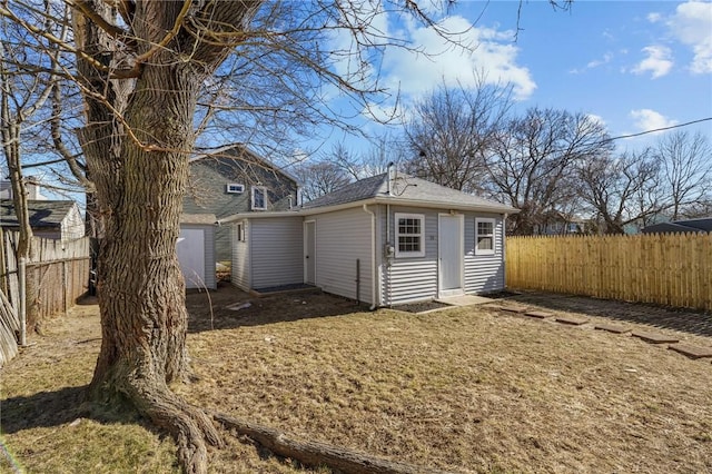 rear view of house with a shed