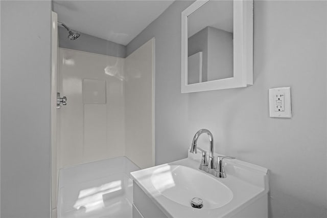 bathroom featuring vanity and walk in shower