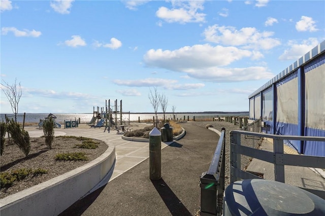 view of play area with a water view