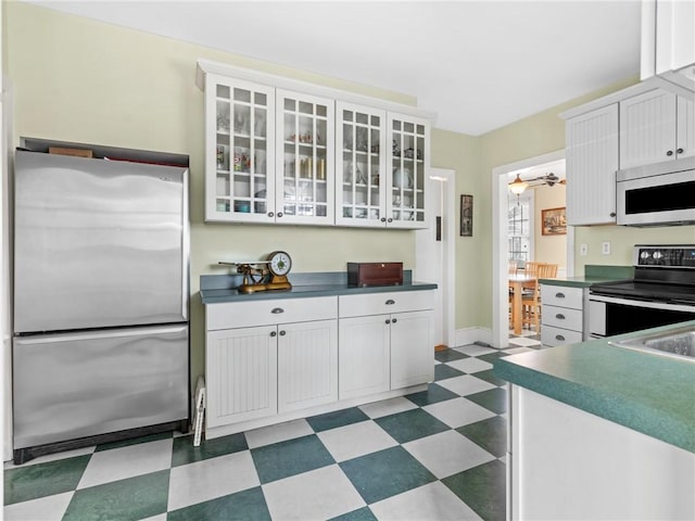 kitchen featuring white cabinetry and stainless steel appliances