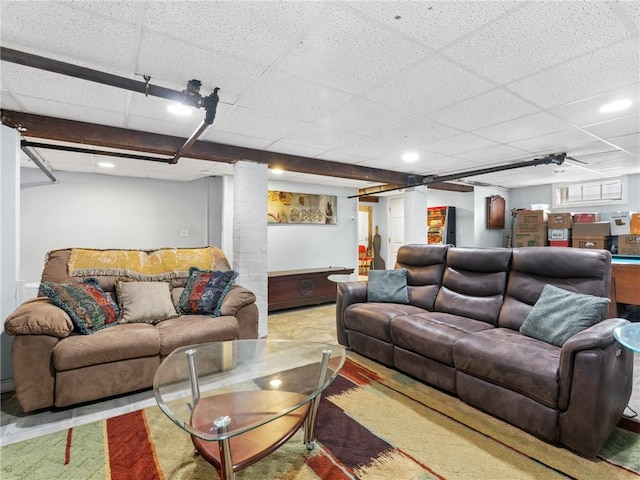 living room featuring a paneled ceiling