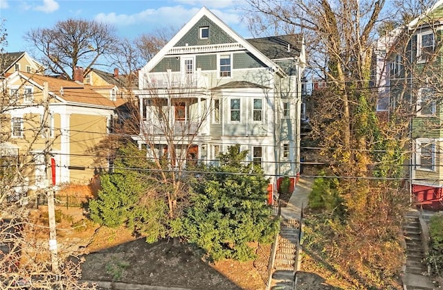 view of front of home with a balcony