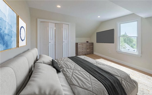 bedroom featuring vaulted ceiling and a closet