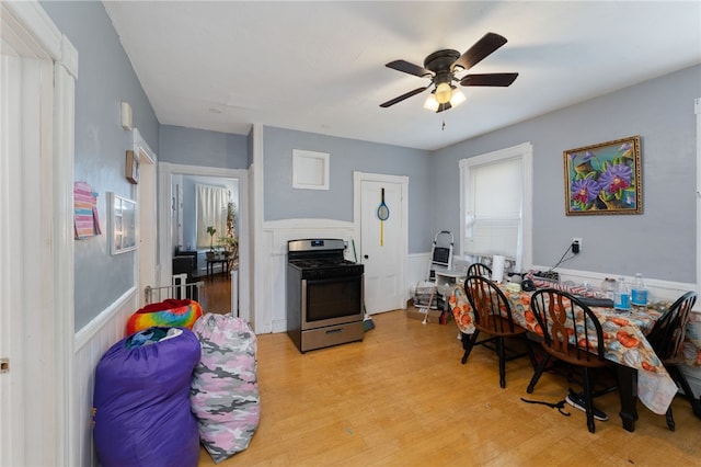 dining room featuring ceiling fan and light hardwood / wood-style floors