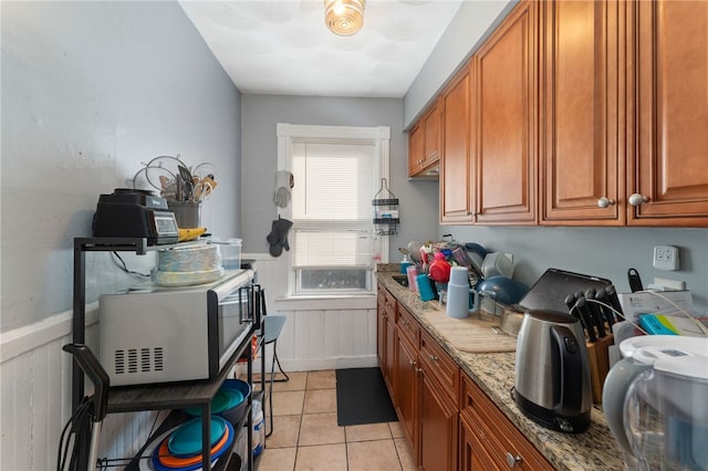 kitchen featuring light stone counters and light tile patterned floors