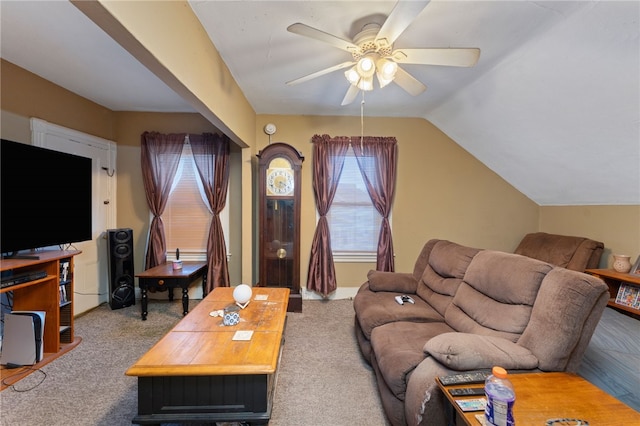 living room featuring lofted ceiling, carpet, and ceiling fan