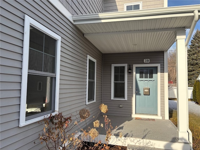 entrance to property featuring covered porch