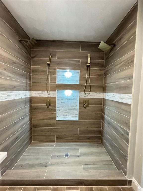 bathroom with a tile shower