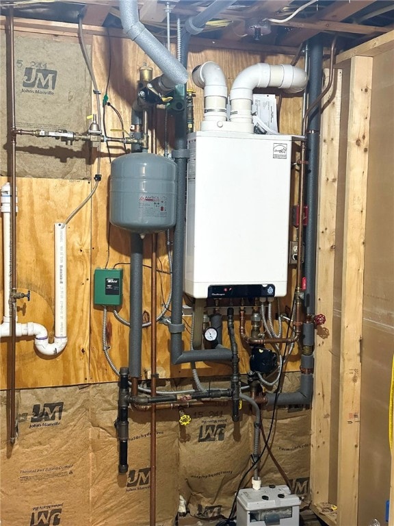 utility room featuring water heater