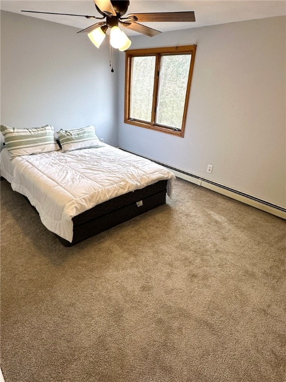 bedroom with a baseboard heating unit, carpet floors, and ceiling fan