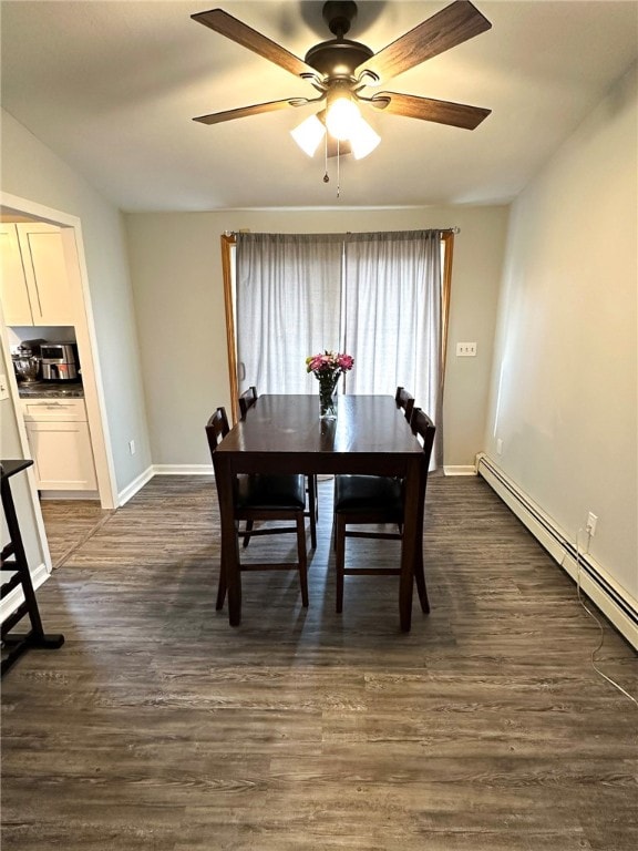 dining space featuring ceiling fan, dark wood-type flooring, and a baseboard radiator