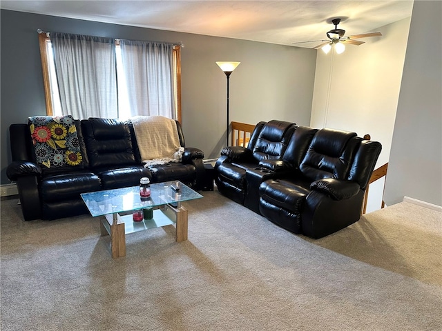 carpeted living room with ceiling fan