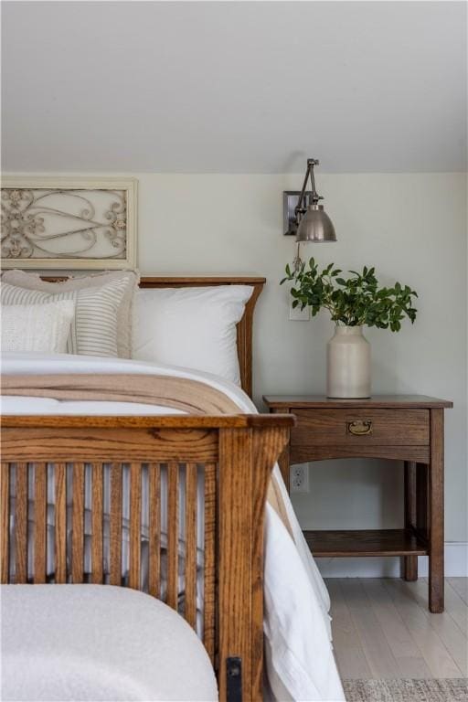 bedroom with hardwood / wood-style flooring