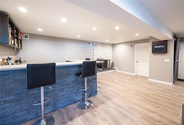 bar featuring hardwood / wood-style floors