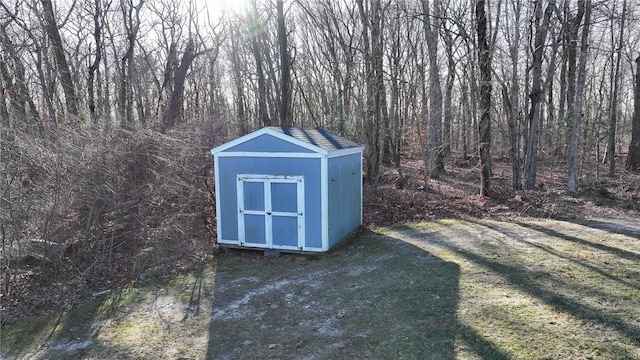 view of outdoor structure with a lawn