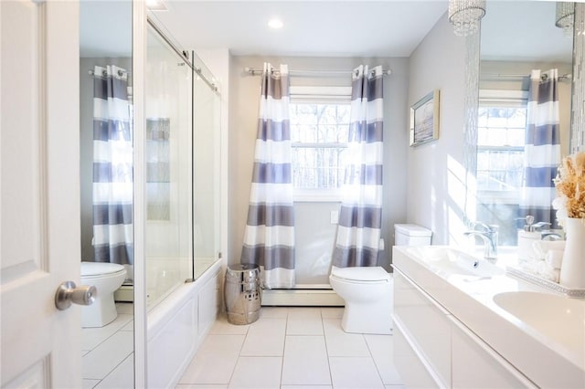 full bathroom featuring a baseboard radiator, combined bath / shower with glass door, a healthy amount of sunlight, and toilet