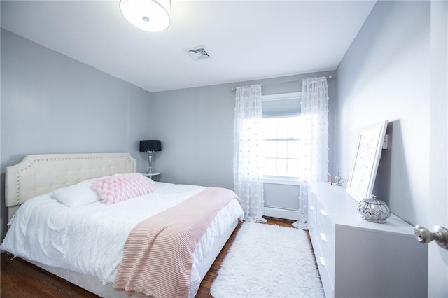 bedroom featuring dark hardwood / wood-style floors