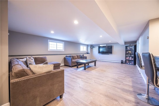 living room with light hardwood / wood-style floors and baseboard heating