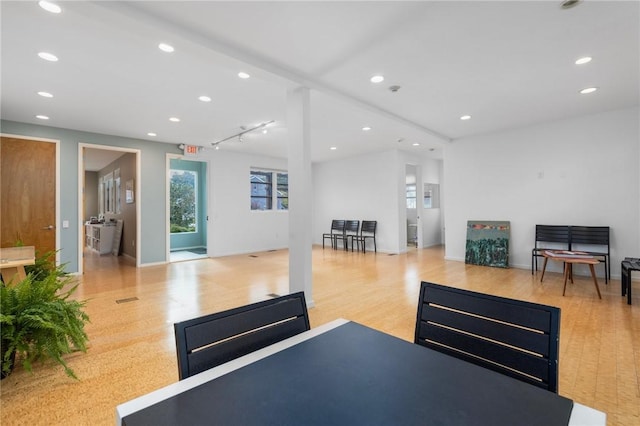 exercise room featuring light hardwood / wood-style floors