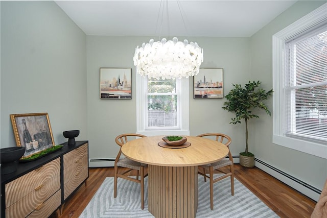 dining area with dark wood-type flooring, a baseboard radiator, and a chandelier