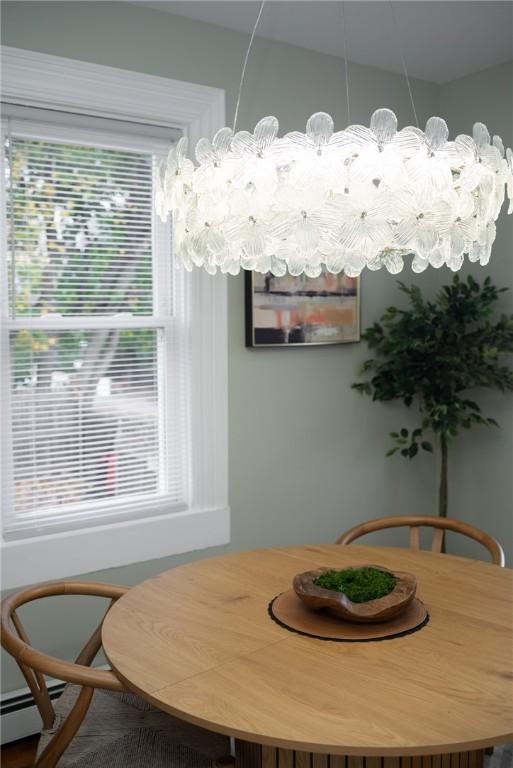 dining space with a baseboard heating unit