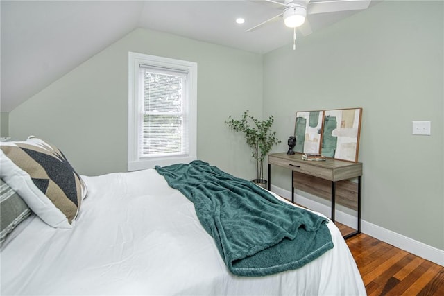 bedroom featuring hardwood / wood-style flooring, vaulted ceiling, and ceiling fan