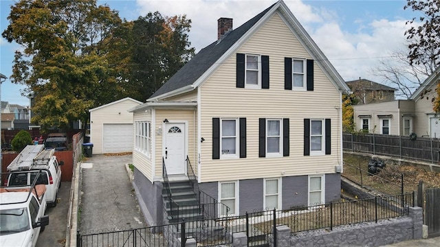 view of front of home with an outbuilding and a garage