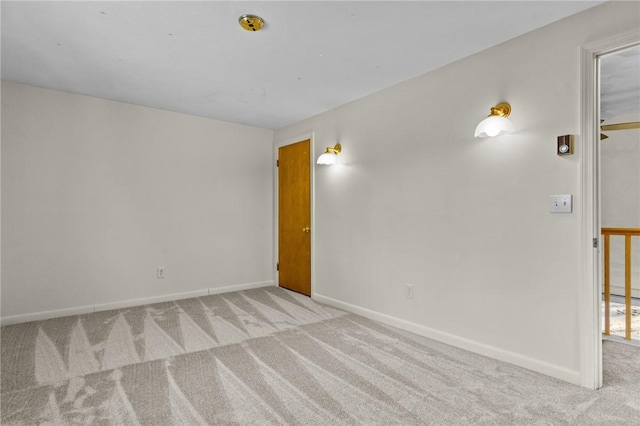 unfurnished room with light colored carpet