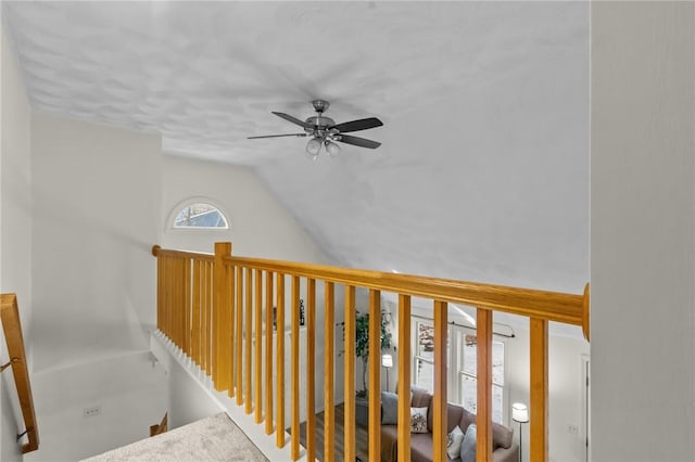 hallway with lofted ceiling