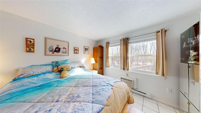 tiled bedroom with a baseboard heating unit, a textured ceiling, and a wall mounted AC