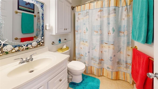 bathroom featuring vanity, toilet, and tile patterned flooring