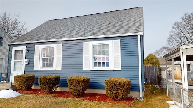 view of property exterior with a lawn