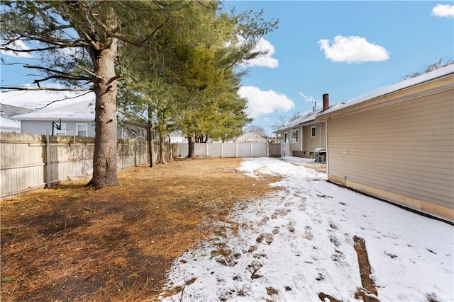 view of yard covered in snow