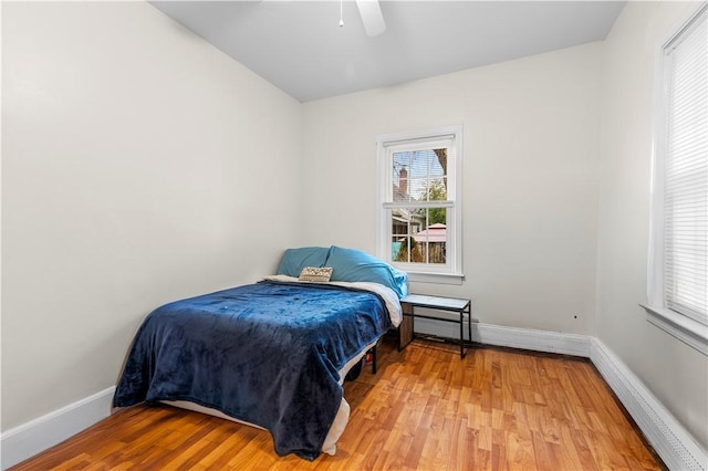 bedroom with hardwood / wood-style flooring and ceiling fan