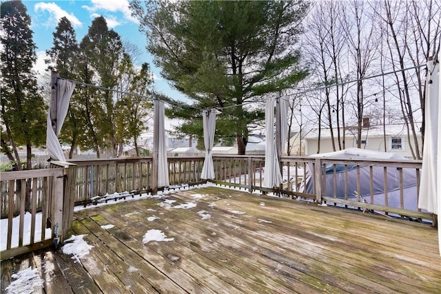 view of snow covered deck