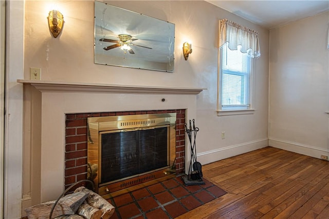 room details featuring wood-type flooring and a brick fireplace