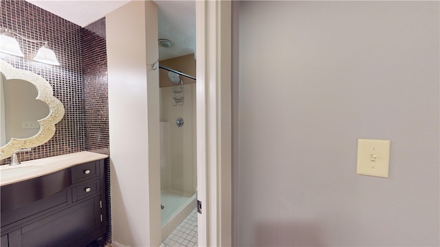 full bathroom featuring a shower stall and vanity