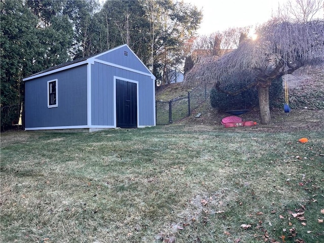 exterior space featuring an outbuilding and fence