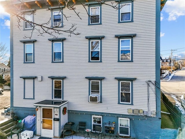 view of front of property with cooling unit