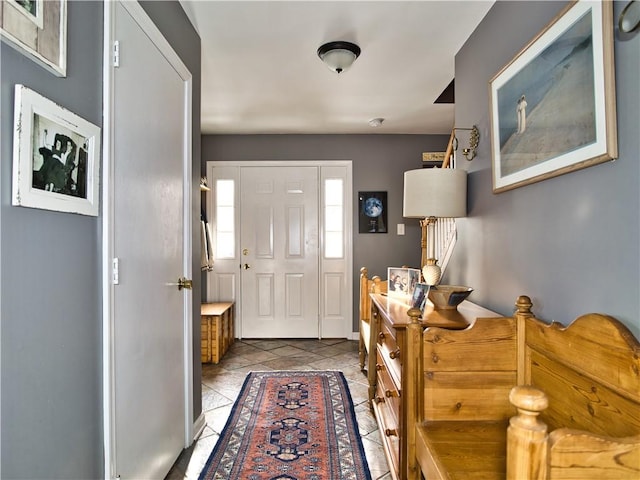 entryway with light tile patterned flooring